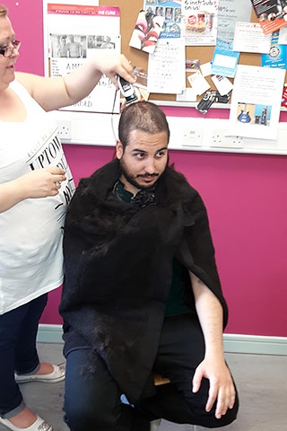 Mauricio Burgazzoli having his head shaved for charity