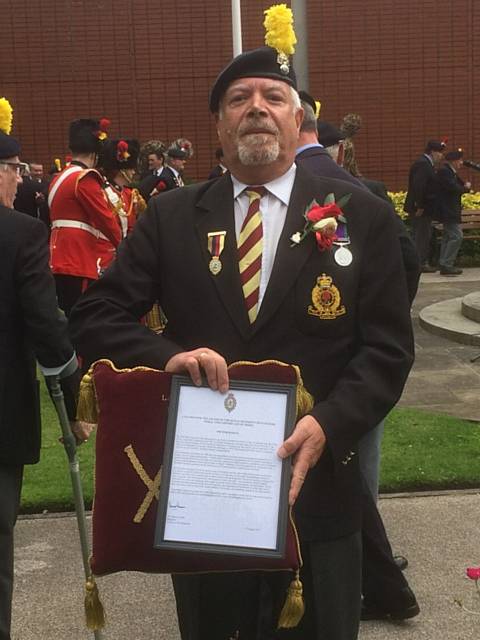 Ex-Rochdale councillor Tom Bailey with The Royal Regiment of Fusiliers’ Medal and Certificate of Merit