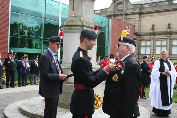 Ex-Rochdale councillor Tom Bailey receives The Royal Regiment of Fusiliers’ Medal and Certificate of Merit from the Colonel of the Regiment, Brigadier D J Paterson OBE 