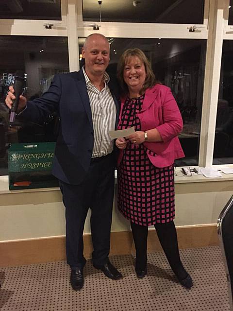 Rochdale Round Table Chairman Jon Geldard presents a cheque to Sarah Ford from Spirnghill Hospice