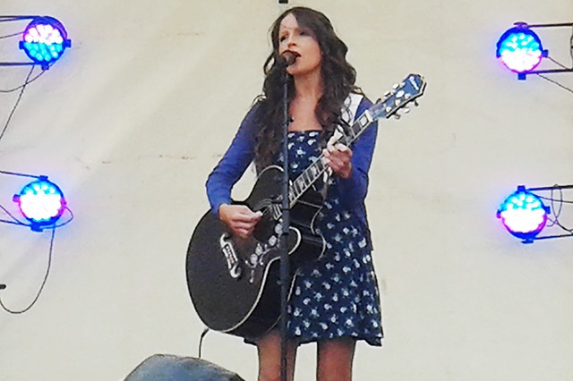 Gem O'Reilly performing her own songs on the community stage at The Feel Good Festival