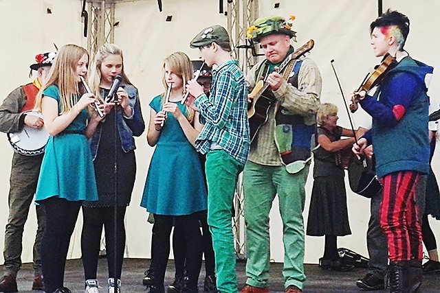 Oakenhoof Cloggers performing traditional Lancashire folk songs on the community stage at The Feel Good Festival