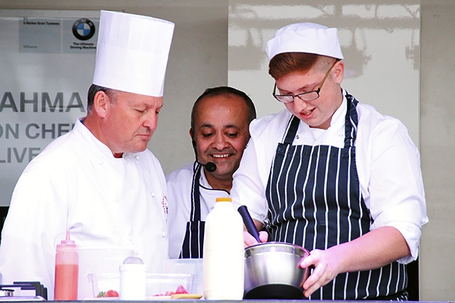 James Holden, Aazam Ahmad and Hopwood Hall student Damien Thompson cook on stage at The Feel Good Festival