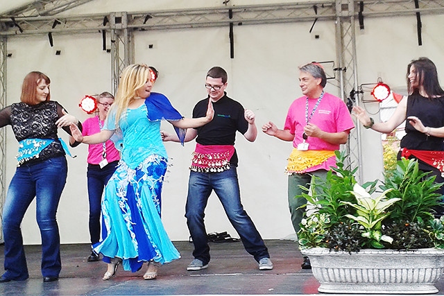 Alexsandra and Roch Valley Radio belly-dancing on the community stage at The Feel Good Festival