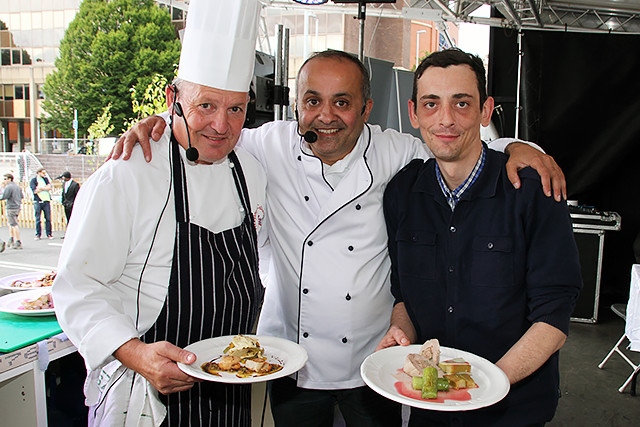 James Holden, Aazam Ahmad and audience participant Michael Cliffe show off the food they cooked at The Feel Good Festival