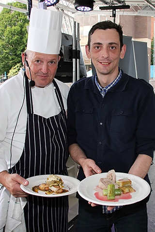 James Holden and audience participant Michael Cliffe show off the food they cooked at The Feel Good Festival