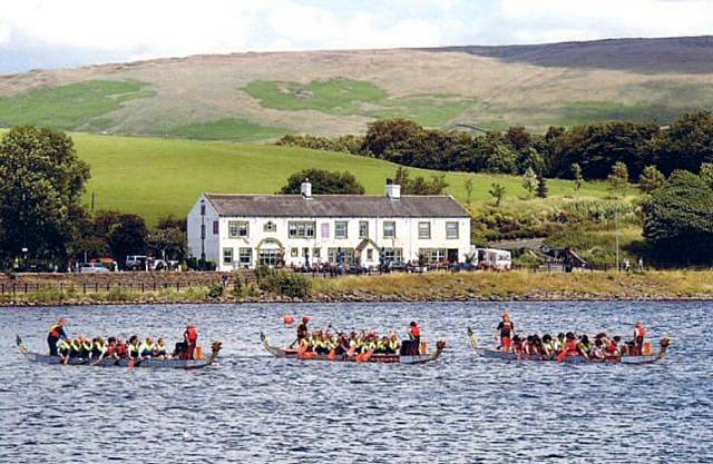 'Dragon Boat Race' by Lynda Redfern is the front page winning photograph for this year