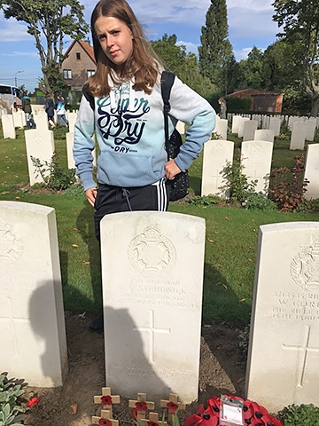 Brooke Strudwick at the grave of Valentine Strudwick at the Tyne Cot War Graves Cemetery