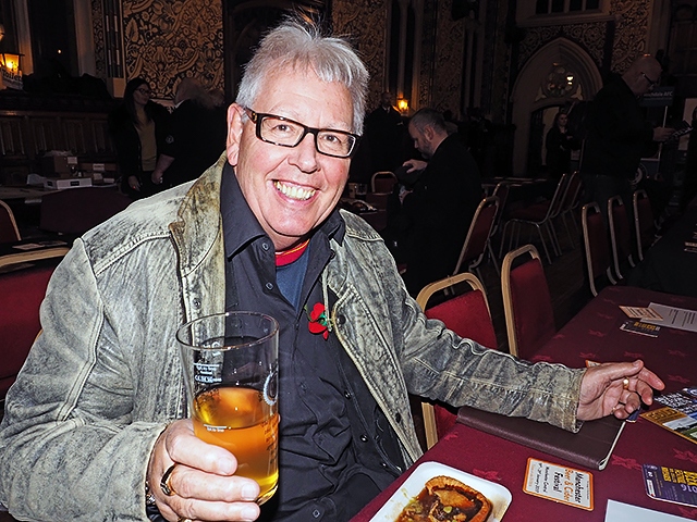 Rochdale's singing jeweller, John Swinden, enjoying a pie and a pint at Rochdale Beer Festival