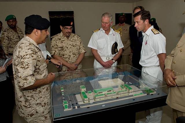 Brigadier Abdu lAziz, director of the Ministry of Military Works, left, briefs His Royal Highness Prince Salman bin Hamad bin Isa Al Khalifa, Crown Prince of Bahrain, centre left, HRH The Prince of Wales and Commodore William Warrender, right, on the layout of the site