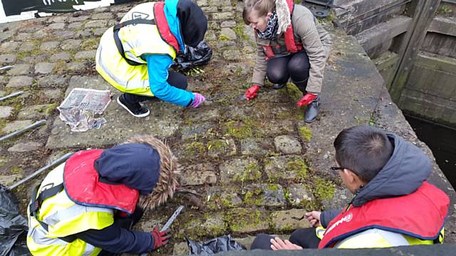 Hopwood students clear walkways and trails, and clean canal cobbles of overgrown moss