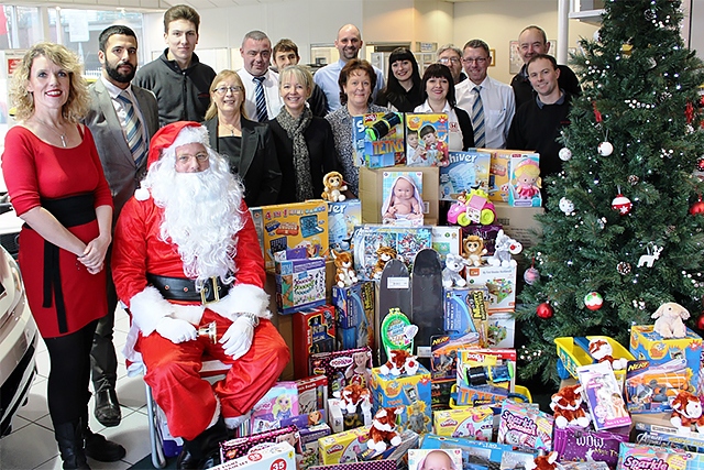 Helen Leach (left) with staff at Swansway Honda in Rochdale, who donated gifts to last year’s toy appeal and will be supporting the appeal again this Christmas