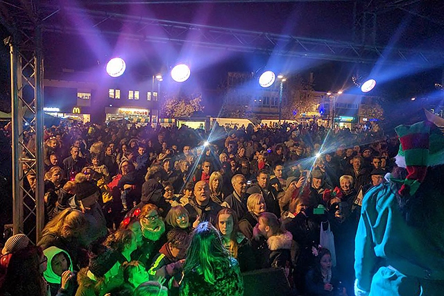 A packed Middleton Gardens watches Samia Ghadie switch Middleton Christmas lights on