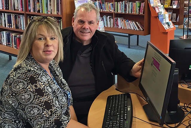 Balderstone and Kirkholt Councillor Richard Farnell and librarian Justine Bull try out one of the new computers