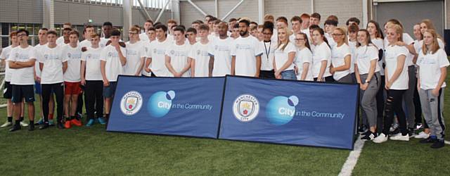 Manchester City F.C players Gael Clichy and Fabian Delph with Hopwood Hall students