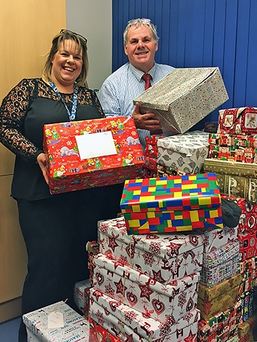 Justine Bull and local Councillor Richard Farnell with some of the gifts donated for the homeless