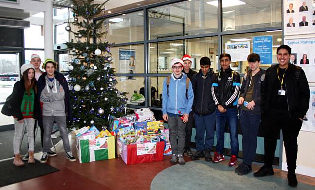 Students from Hopwood Hall College visit Key 103 to donate toys to children living in poverty