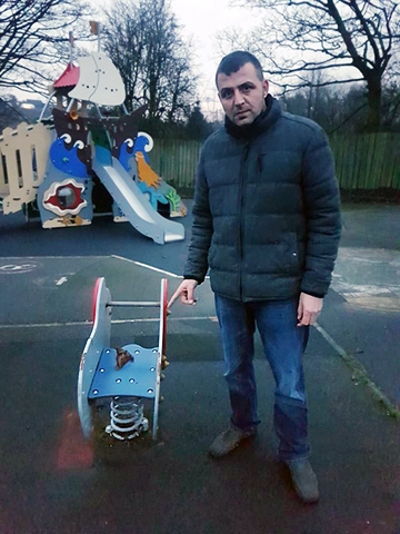 Paul Ellison pointing to the human excrement left on a children's ride in Norden