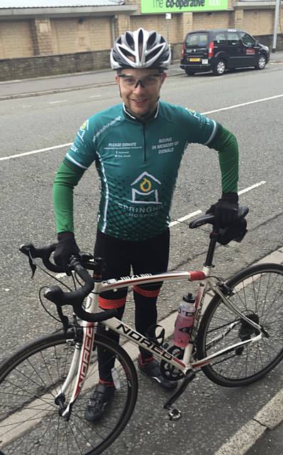 Andrew Duxbury, getting on his bike for Springhill Hospice