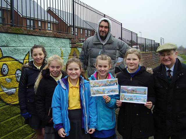 St Edwards children who designed the mural that now covers a mass of grafitti with the company who painted the mural called Spearfish and Councillor Billy Sheerin 
