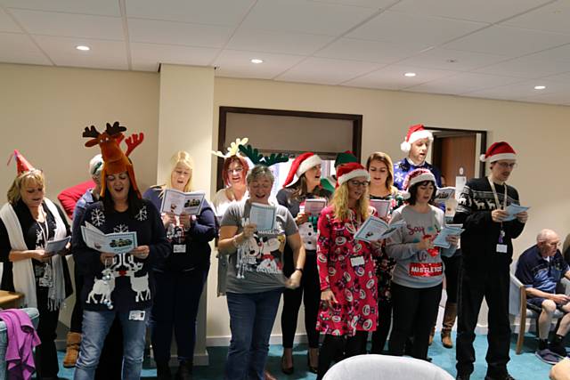 RBH employees entertaining tenants with carols, mulled wine and mince pies