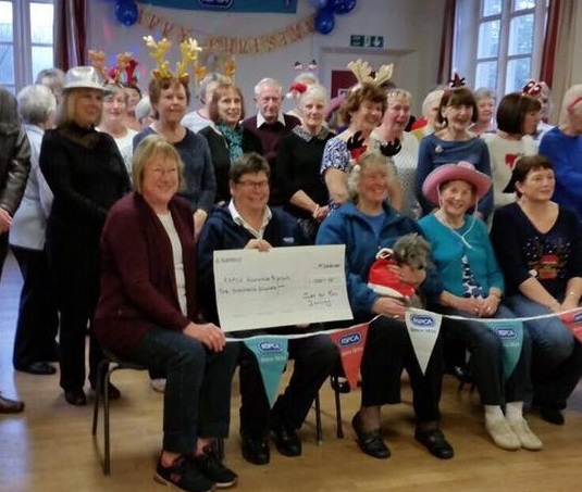 Just For Fun line dancing group present a cheque for £1,000 to the RSPCA Rochdale branch