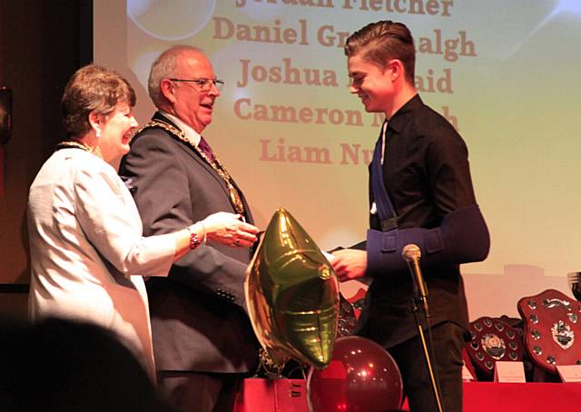 Sam Pakes being presented with an Attainment Award by the Mayor and Mayoress