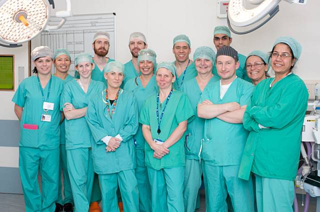 Consultant Damir Kosutic (dark hat) with the team who operated on Adelaide