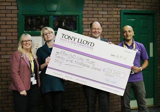 Deputy Police and Crime Commissioner Jim Battle presenting a cheque to Rochdale Boroughwide Housing and the No Way Trust