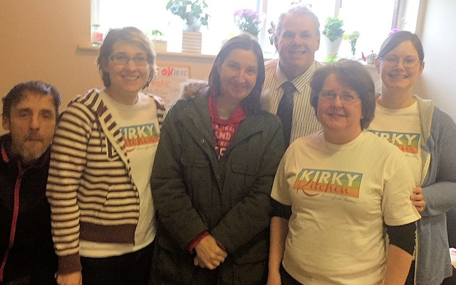 Councillor Richard Farnell joins Rev Angela Bryan, helpets and customers at the Kirky Kitchen