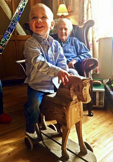 Derek and Joseph Addy with 1930s toy horse