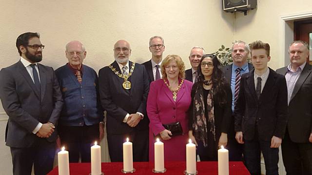 The lighting of the six candles of remembrance with Usman Nawaz, Henry West MBE, Mayor Surinder Biant, Steve Rumbelow, Cllr Cecile Biant, Cllr Ashley Dearnley, Saiqa Naz, Cllr Farnell, Ethan Marriott, Adrian Palmer