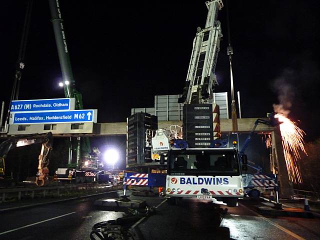 Overhead gantry on the M62 near Rochdale, being removed in December 2015