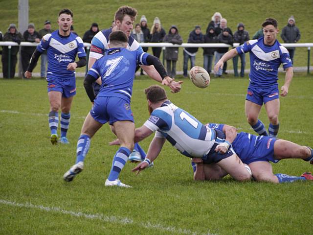 Aiden Gleeson getting the offload away
