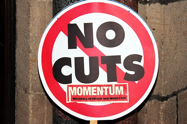 Momentum no cuts placard