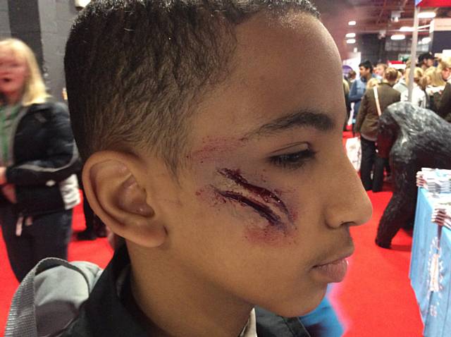 Realistic-looking gashes on this young visitor’s face