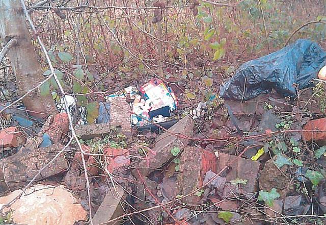 Fly-tipped waste on Hilton Fold waste land, Middleton