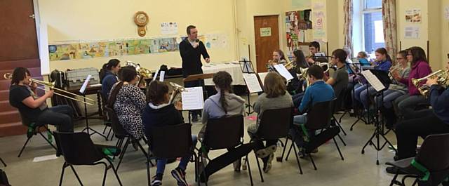 Besses Boys MD Tom Ridgley conducts the first North Manchester Youth Band rehearsal at Middleton Youth Bands band room