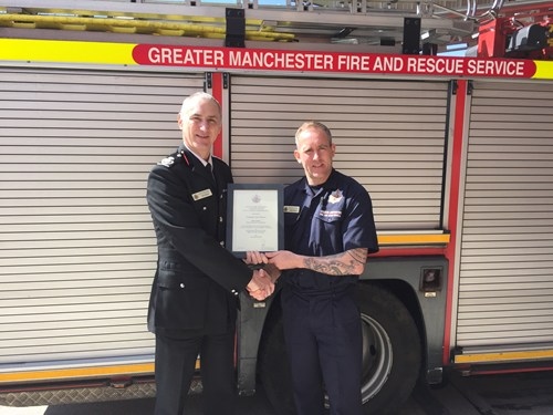 Chris Watson being presented with his award