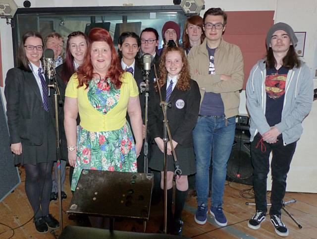 'Children of Syria' charity single, College students Michael Hall, Karl Harris, Luis Oddy and Dan Beck with the girls from Falinge Park High School and Jacqui Farasowskyie