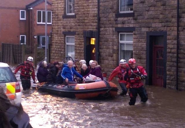 Residents of Olive Standring House being evacuated on Todmorden Road. Boxing Day 2015