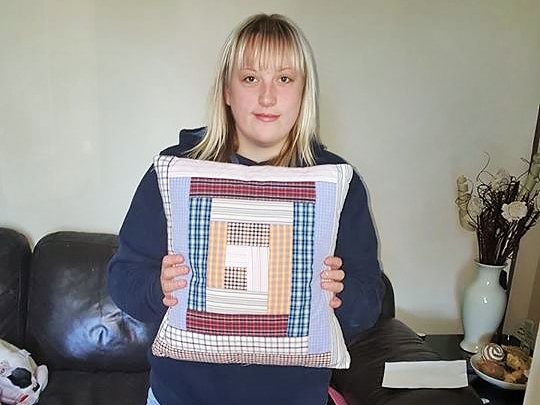 Amy Law with the cushion made entirely of her late granddad’s old shirts