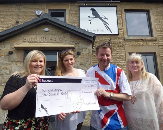 Andrew Nutter presents the cheque for £4,000 to Melanie Caffrey from Springhill Hospice together with Hannah Powell, landlady of The Bird At Birtle, and Louise Scott from H Bell & Sons