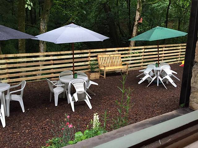 The bench in The Riverside Tea Garden in memory of Stephen Moore who was a volunteer at the Healey Dell Heritage Centre & Tea Room