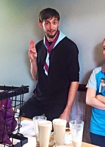 Barista Jensen Forshaw wearing a Girlguiding Senior Section neckerchiefs