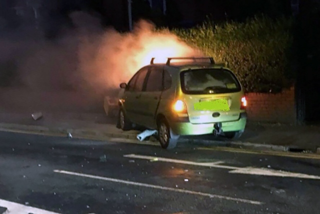 A car burst into flames after crashing into a speed camera following a police chase