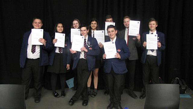 Whitworth Community High School’s debating team with their certificates from the Burnley College competition