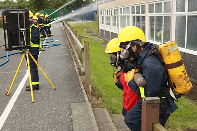 Cadet Thomas Lomax and Jennifer Forbes rescue a dummy casualty