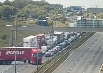 Standing traffic on the westbound M62 and traffic being directed off at junction 21