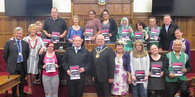 Rochdale Environmental Action Group members and other volunteers receiving certificates from Mayor Ray Dutton